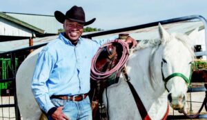 James Holmes comes to work with his cowboy hat and boots. He shares a love of horses with Tweet Kimball and rides every week. Photo by Paul DiSalvo