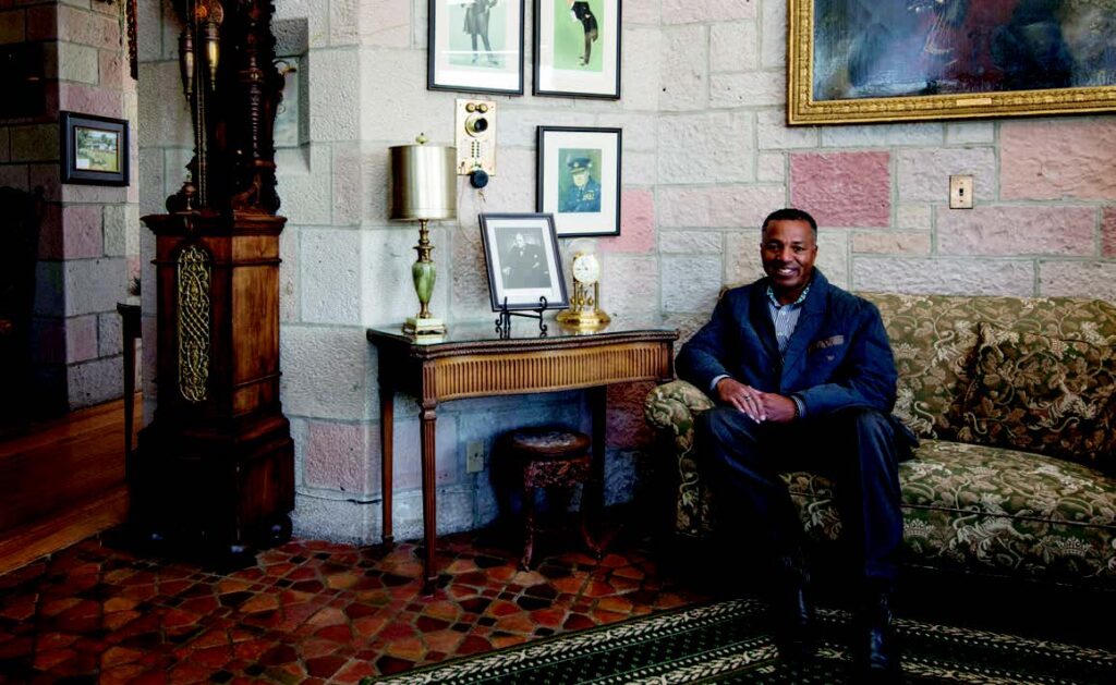 James Holmes sits in the Winston Churchill room, a small alcove with busts and drawings of the late British prime minister. Photo by Paul DiSalvo