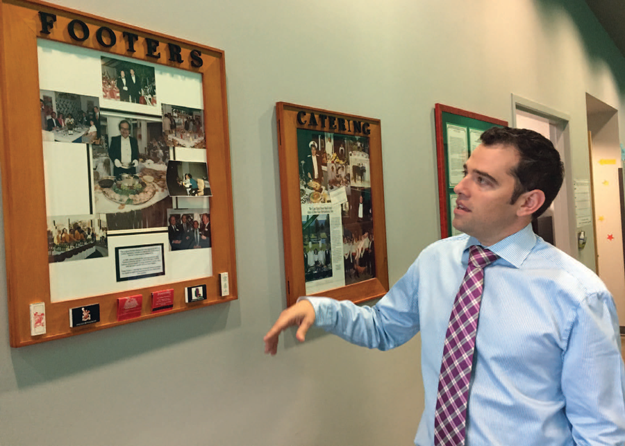 Anthony shows pictures on the wall of his dad and how Footers got started. They want to keep that legacy readily visible so their employees and clients know the history.
