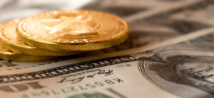 Coins resting on top of paper money.